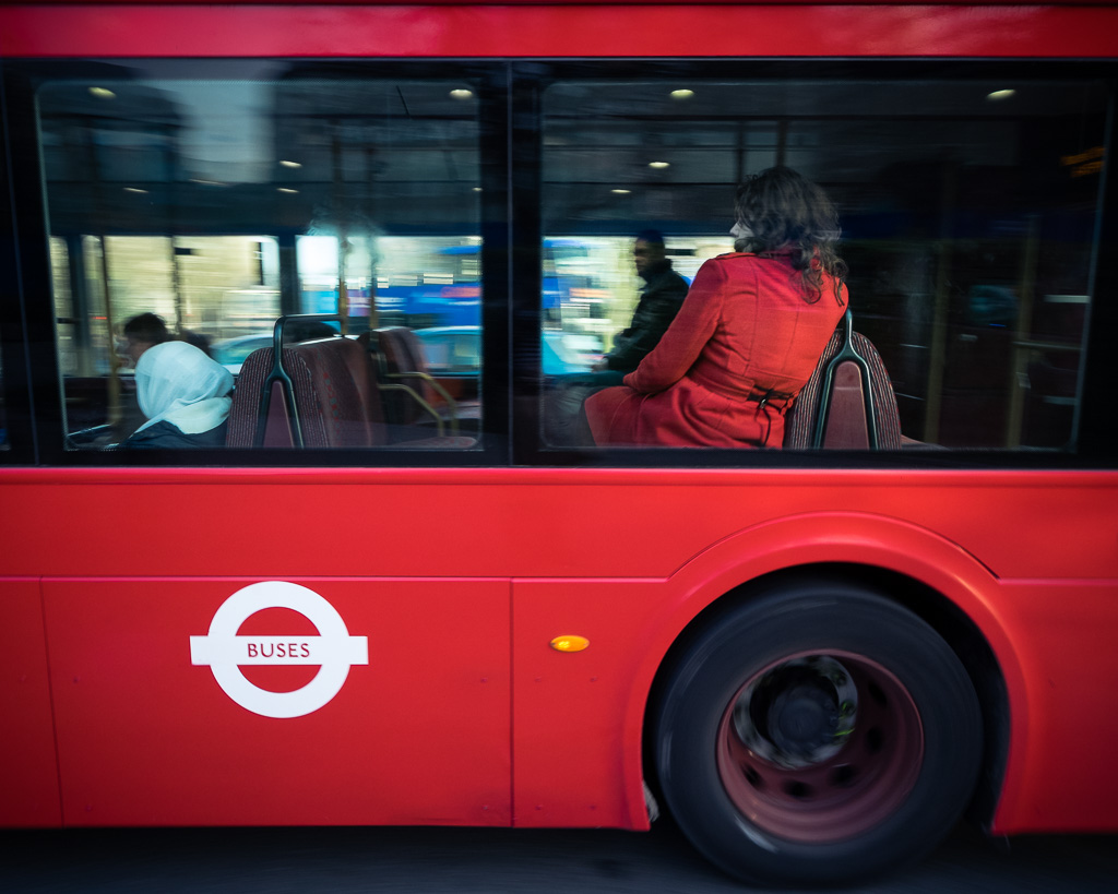 Red coat & bus.